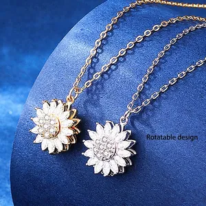 Rotating sunflower necklace with sparkling zircon crystals in gold and silver finish