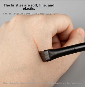 Detailed view of ultra-thin angled eyeliner brush bristles for precise makeup application