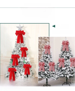 Detail showing red flocked and striped Christmas bows on a snowy Christmas tree