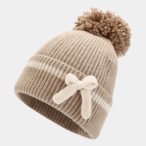 Winter knitted beanie set for girls featuring a large pom-pom and sweet bow decoration