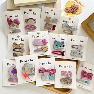 Glitter bow and cartoon hair clips set for girls featuring rainbow and star designs