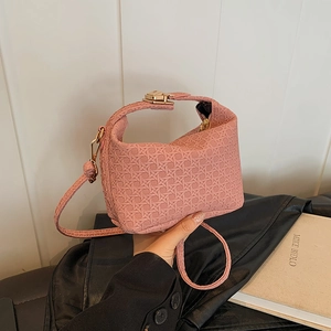 Pink woven texture pillow bag for women with gold hardware and stylish crossbody strap