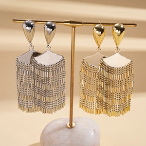 Chic gold and silver fan-shaped tassel earrings displayed on a premium metal jewelry stand