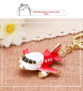 Detailed macro view of red A380 airplane keychain with sparkling crystal rhinestones