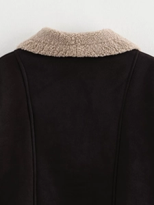 Close-up detail of warm brown suede fabric and beige sherpa fleece collar on jacket back