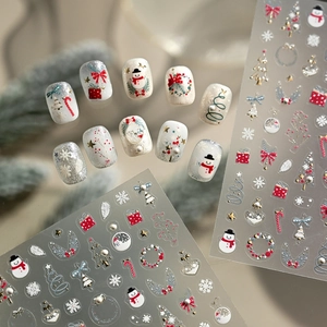 5D embossed Christmas nail stickers featuring luxury gold trees, bells and stars for manicure