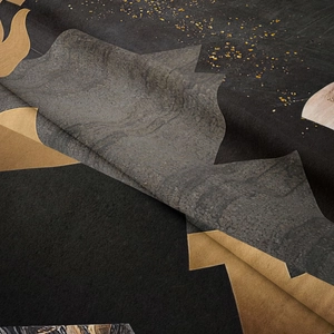 Macro detail of mountain tapestry fabric showing golden textures and soft matte finish