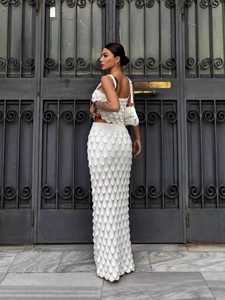 White knit two-piece set featuring a cropped tank top and fish-scale texture maxi skirt