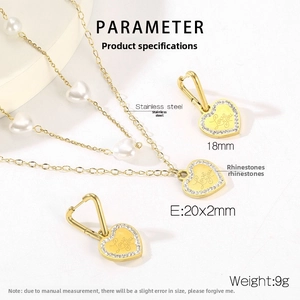 Detail of gold heart pendant with Love You engraving and sparkling rhinestones set