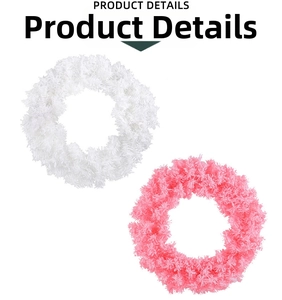 Detail of soft plush Christmas wreaths in white and cherry pink for door and window decor