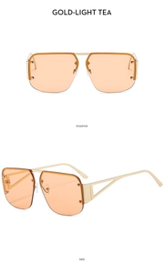 Detail view of gold metal half-frame square sunglasses with light tea lenses and rivets