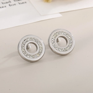 Macro shot of silver circular stud earrings featuring a full border of white zircons
