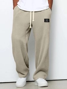 Men's khaki waffle knit straight leg sweatpants with drawstring and casual style