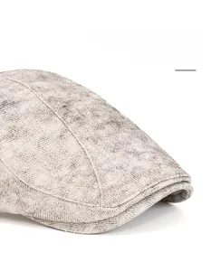 Detail of vintage washed cotton flat cap featuring a foldable and widened wide brim