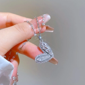 Macro view of luxury heart pendant with shimmering rhinestones and zirconia details