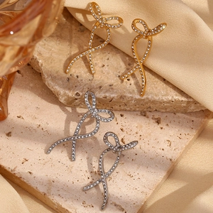 Bowknot ribbon earrings in gold and silver finish with pavé rhinestones on stone base