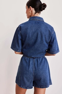 Detail view of denim texture on the back of loose-fit short sleeve shirt and shorts set