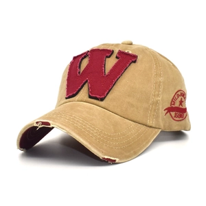 Close-up of khaki washed cotton baseball cap with red embroidered W patch and distressed brim