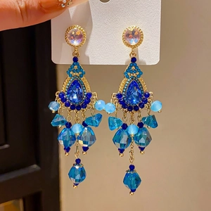 Detailed close-up of vintage blue crystal teardrop earrings with S925 silver needles