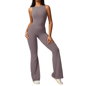 Women's backless flared yoga jumpsuit in dusty purple featuring a high-waist peach lift fit