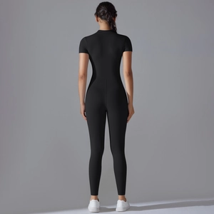 Rear view of black compression yoga bodysuit showing slim fit and athletic silhouette