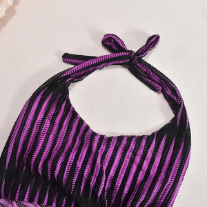 Detailed view of purple and black striped ribbed knit halter neck straps and texture