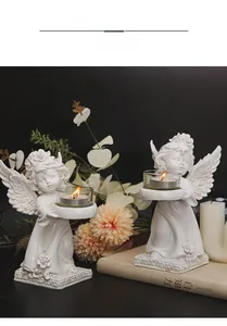 Macro detail of white wing textures on a European angel candle holder with glass cup