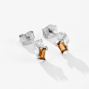 Macro side view of S925 sterling silver earrings with champagne rectangular gemstones