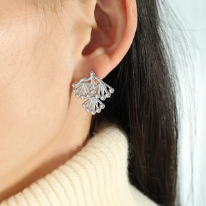 Silver pine branch stud earrings for women featuring artistic plant leaf cluster design