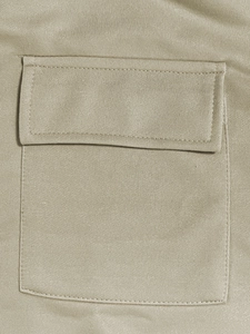 Detail of khaki hoodie pocket showing premium stitching and textured jersey fabric