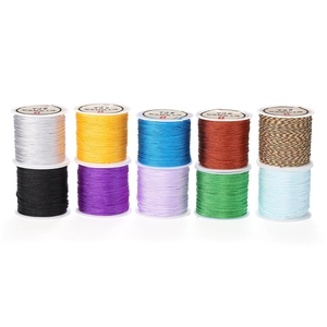 Macro detail of ten multi-color 0.8mm polyester braided cords for DIY jewelry making
