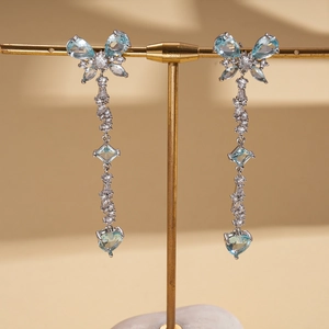 Elegant silver tassel earrings featuring light blue butterfly zircon and heart stones