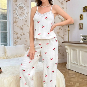Three-piece women's pajama set featuring cherry print and delicate lace trim in cream white