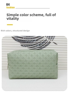Front detail of light green woven texture toiletry bag with top zipper closure