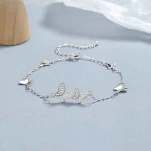 Detailed macro shot of 925 silver butterfly bracelet featuring pavé-set cubic zirconia accents