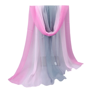 Elegant pink and grey gradient chiffon scarf hanging on a white background