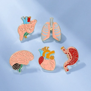 Detail view of 5-piece organ enamel pins set featuring brain and heart on blue background