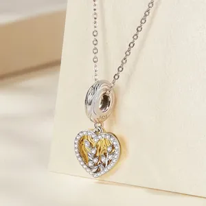 925 sterling silver heart charm with gold accents and sparkling cubic zirconia stones