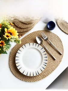 Macro detail of handwoven jute placemats with spiral texture and rustic natural finish