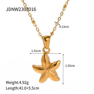 Golden starfish pendant necklace with textured surface and beaded chain for beach vacations