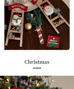 Detailed view of wooden Christmas ladder with Santa, snowman and festive greeting cards