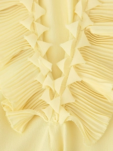 Chic yellow chiffon V-neck blouse featuring sophisticated triangular pleated ruffle details