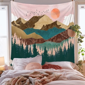 Detail of bohemian mountain tapestry above bed with abstract forest and sun art