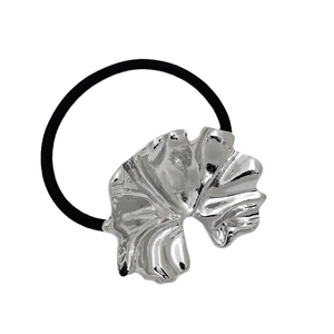 Punk style hair tie with silver irregular leaf-shaped metal charm on black elastic band