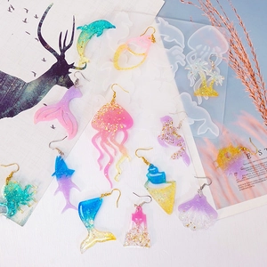 DIY ocean themed silicone molds for resin earrings featuring dolphins shells and anchors