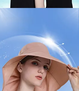 Detail of wide brim sun hat showing pale pink fabric texture and neck protection flap