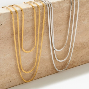 Three-layer minimalist flat snake chain necklace in gold and silver stainless steel