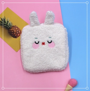 Detail of soft plush sanitary pad pouch with cute rabbit ears and smooth zipper closure