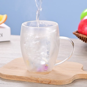 Double walled borosilicate glass mug with flowing sand holographic dry flower effect