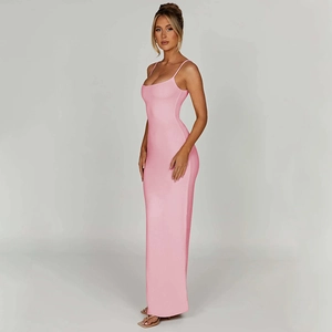 Side view of a slim-fit pink maxi dress with backless design and draped fabric detail